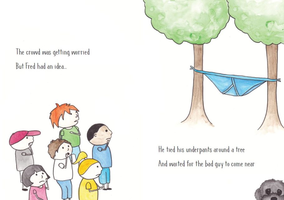 A group of children watches a giant set of underpants suspended between two trees.