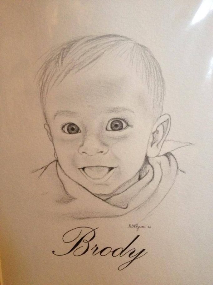 A pencil sketch of a smiling baby named Brody.