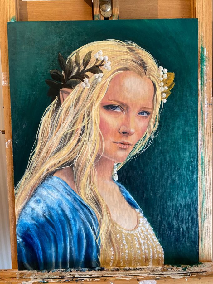 A portrait of a woman with long blonde hair, wearing a blue garment and floral accessories.