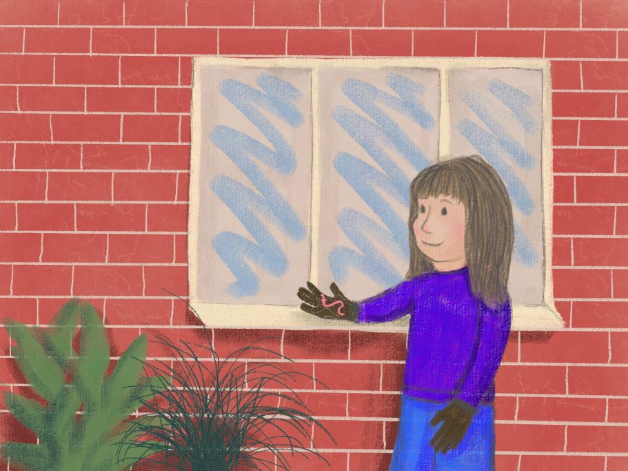 Me, as a child standing in my childhood garden with gloves on, holding a worm